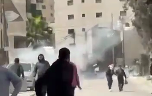 Thumbnail preview image for the video titled: Terrified Palestinian residents are fleeing as Israeli occupation forces fire teargas in the Shuafat RC