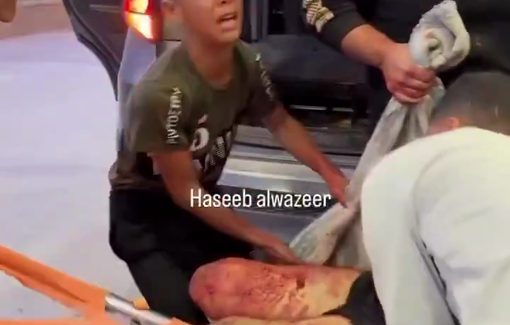 Thumbnail preview image for the video titled: Boy runs after his disabled father wounded by an Israeli airstrike on tents