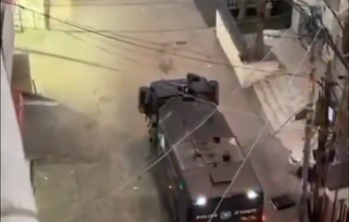 Thumbnail preview image for the video titled: Several videos show Israeli trucks spraying skunk water and soldiers throwing grenades on Issawiya streets