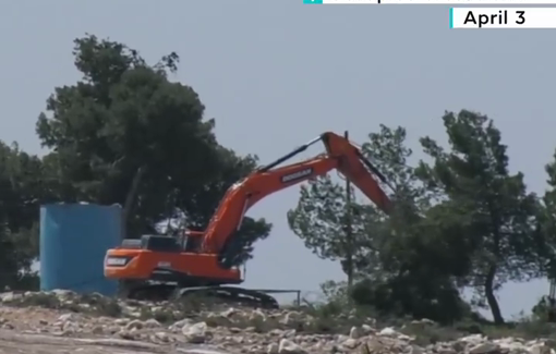 Thumbnail preview image for the video titled: Illegal Israeli settlers use an excavator to uproot and demolish trees on Palestinian-owned land in Hebron