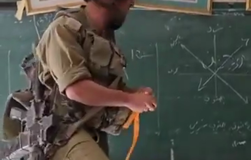 Thumbnail preview image for the video titled: An IDF Officer inside a Gazan School delivers a “Zionist humanitarian teaching mission in Gaza” that includes the call to return of settlements to Gaza (Gush Katif).