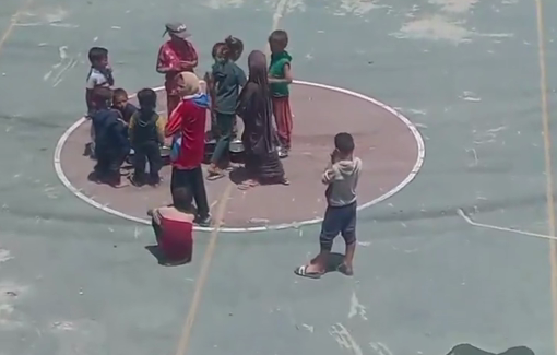 Thumbnail preview image for the video titled: Children gather at what used to be a food distribution center but Israel has ensured there is no food