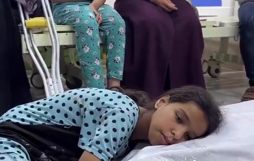 Thumbnail preview image for the video titled: Child embraces the bodies of her killed mother and brother