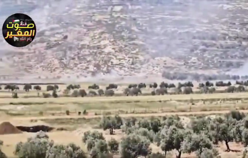 Thumbnail preview image for the video titled: Israeli settlers backed by soldiers set crops on fire and storm the residents' tents in the Al-Khalaya area of Al-Mughayyir