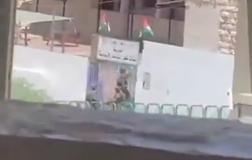 Thumbnail preview image for the video titled: Israeli soldiers climbing up to tear down the Palestinian flag at a school in Salfit, West Bank