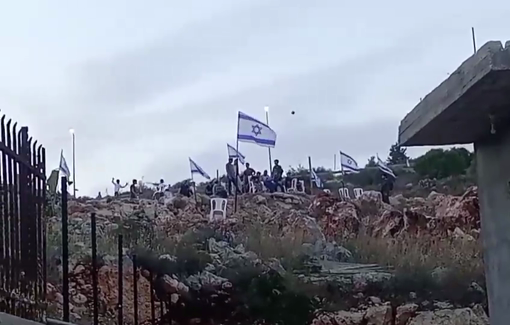 Thumbnail preview image for the video titled: Raising the Israeli occupation flag, Israeli settlers marched near the homes of Palestinian families in Burqin