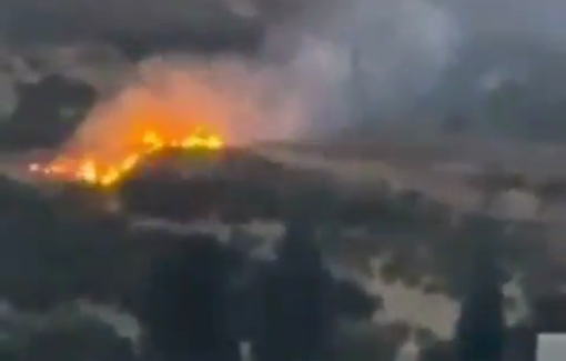 Thumbnail preview image for the video titled: Israeli settlers set fire to Palestinian-owned lands at the entrance to the village of Al-Mughayyir