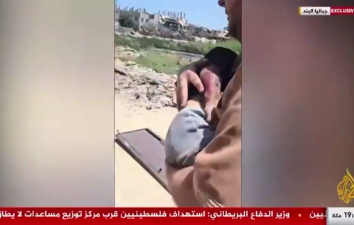 Thumbnail preview image for the video titled: Distraught father carries his only child critically wounded in a strike on their home