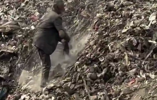 Thumbnail preview image for the video titled: An elderly man searches through the piles of garbage for something to feed his children in Gaza