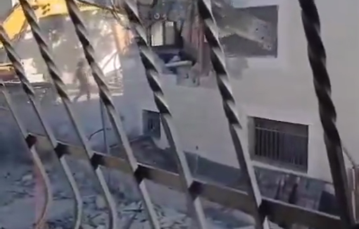 Thumbnail preview image for the video titled: The Israeli Hyundai bulldozers continue demolishing a two-story house in the town of Hizma, northeast of occupied Jerusalem