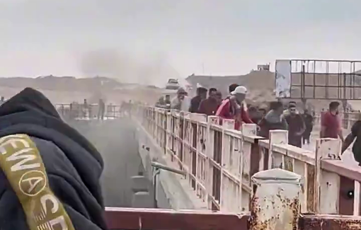 Thumbnail preview image for the video titled: Israeli tank closes in on civilians moving under gunfire at the Netzarim GHF site