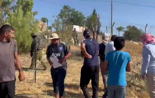 Thumbnail preview image for the video titled: Settlers have invaded the village of Umm al-Khair and are working on building a fence on village land
