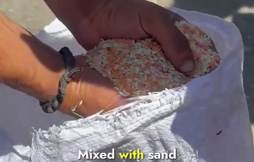 Thumbnail preview image for the video titled: Palestinians scrape paltry low quality food from GHF sites on a daily basis