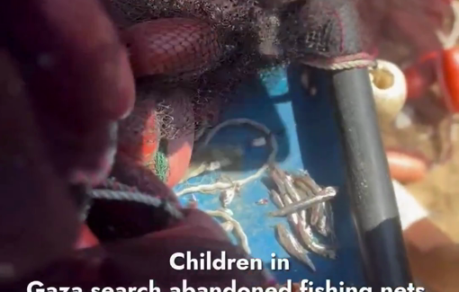Thumbnail preview image for the video titled: Children comb through abandoned fishing nets for any leftover fish