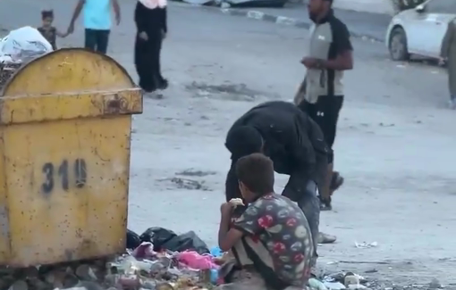 Thumbnail preview image for the video titled: Man and his children rummage through garbage to ease their hunger