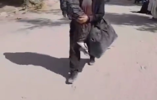 Thumbnail preview image for the video titled: A young man carrying his mother, fleeing from Jabalia to the west of Gaza (around 15 kilometers)