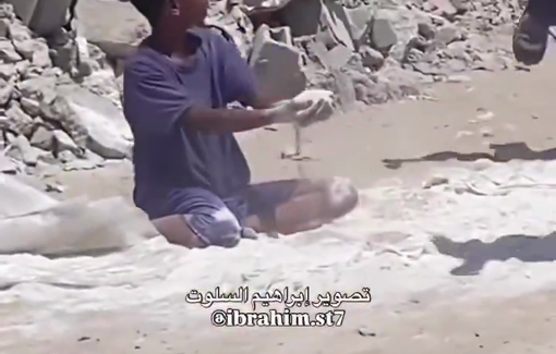 Thumbnail preview image for the video titled: Child picks up spilled flour amid acute starvation engineered by Israel
