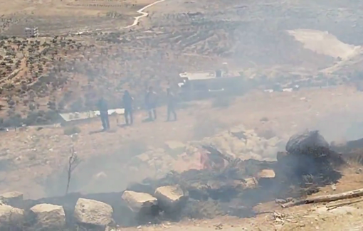 Thumbnail preview image for the video titled: Israeli settlers in the church yard of e Taybeh after setting it on fire