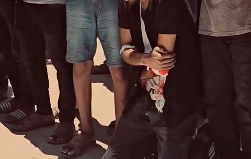 Thumbnail preview image for the video titled: Two Palestinians mourn aid seekers killed on the way to receive the aid in GHF distribution point