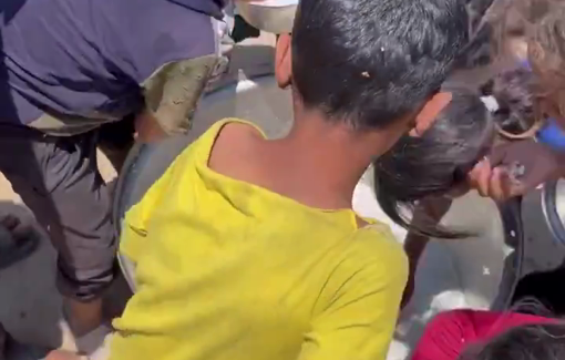 Thumbnail preview image for the video titled: Starved children scrape the bottom of a pot for food