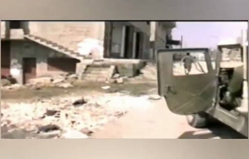Thumbnail preview image for the video titled: 1987: IDF soldiers chase a child in Jabalia