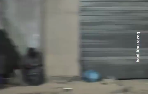 Thumbnail preview image for the video titled: Displaced families sit on the sidewalk after Israel bombed residential towers in Gaza City