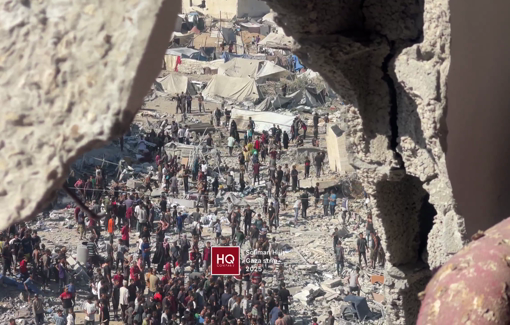 Thumbnail preview image for the video titled: Woman salvages her belongings from the rubble of a block destroyed by Israeli bombing