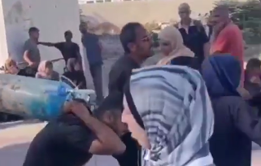 Thumbnail preview image for the video titled: Parents carry wounded child, his IV and oxygen tank