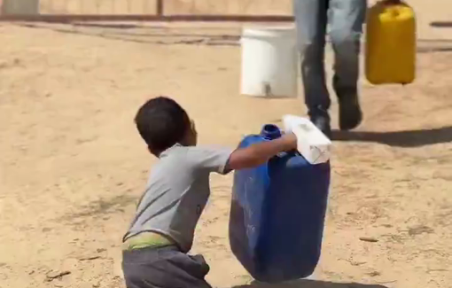 Thumbnail preview image for the video titled: Child with a disability crawls while dragging a large water container