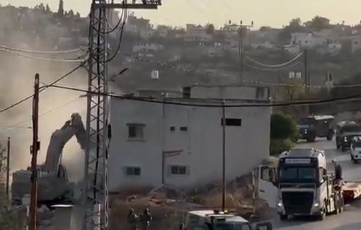 Thumbnail preview image for the video titled: An Israeli bulldozer detroyed the home of the father of prisoners Maher and Jamil Samara, in Burqin