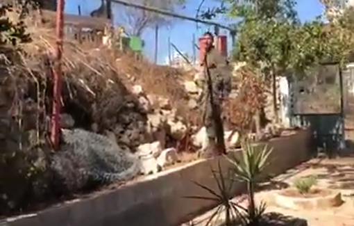 Thumbnail preview image for the video titled: Israeli soldier invaded the Issa Amro home and threatened his friends