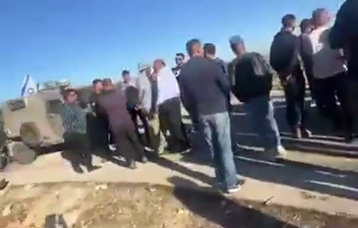 Thumbnail preview image for the video titled: Israeli soldiers preventing farmers to harvest their olive trees near the village of Mazra'a Al-Sharqiya
