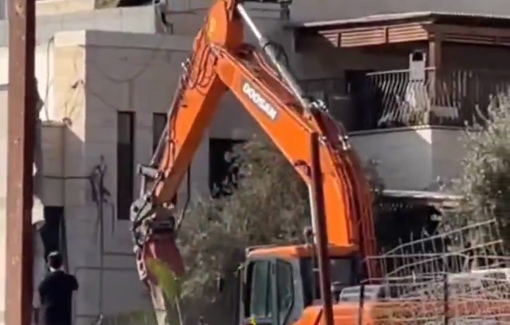 Thumbnail preview image for the video titled: Israeli Doosan bulldozers demolished the wall of the home of Abu Sunaina family in At-Tur