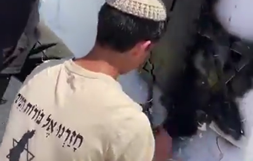 Thumbnail preview image for the video titled: Israeli settlers spray roads with slogans of settlement groups in West Bank