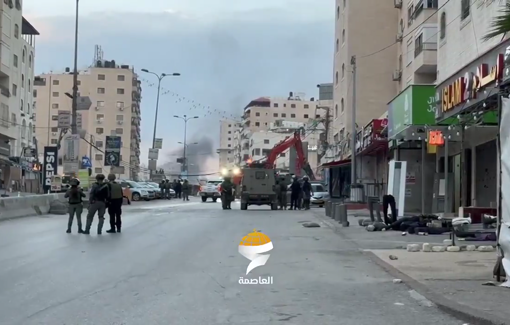 Thumbnail preview image for the video titled: Israeli bulldozers demolish commercial shops during their raid on Kafr Aqab