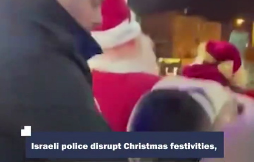 Thumbnail preview image for the video titled: Israeli police disrupted Christmas celebrations in Wadi al-Nisnas neighborhood in Haifa