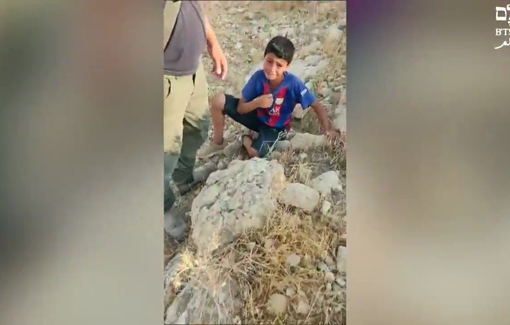 Thumbnail preview image for the video titled: A Bedouin little boy from Khan al-Ahmar detained at gunpoint by an armed settler from Kfar Adumim