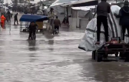 Thumbnail preview image for the video titled: Heavy rainfall floods the streets of the camp fragile tents in Al-Mawasi