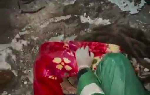 Thumbnail preview image for the video titled: A woman killed and a number of people injured as a result of a large wall collapsing onto the tents