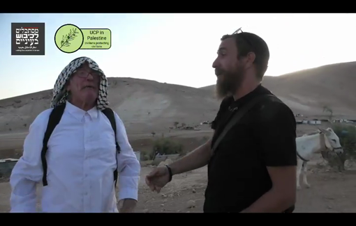 Thumbnail preview image for the video titled: Armed settler Gavriel Kalish slaps a phone from an activist’s hand while trespassing on Palestinian land