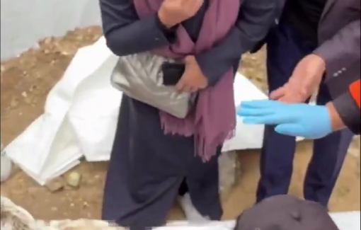 Thumbnail preview image for the video titled: A woman weeps as her husband’s body is transferred from an unidentified grave in Gaza