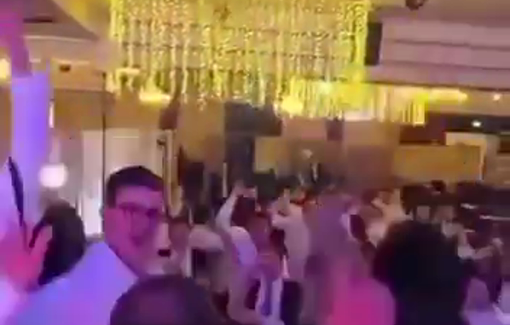 Thumbnail preview image for the video titled: Israeli settlers celebrate a wedding by raising knives and pistols and calling for the burning of Palestinian villages