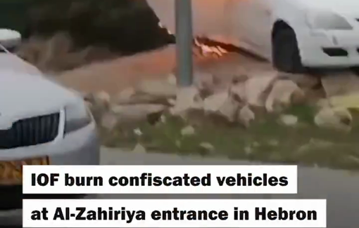 Thumbnail preview image for the video titled: Israeli forces burn vehicles after confiscating them from Palestinians at the northern entrance of the town of Al-Zahiriya, south of Hebron,