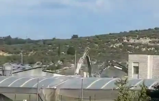 Thumbnail preview image for the video titled: Israeli bulldozers tear down Palestinian residential and agricultural facilities in the town of Beit Liqya
