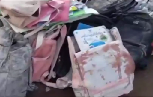 Thumbnail preview image for the video titled: School books and bags scattered and stained with blood is is what the U.S.-Israeli airstrike left behind at an elementary girls' school in Minab