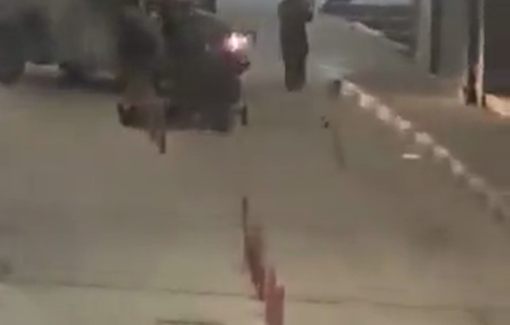 Thumbnail preview image for the video titled: Footage shows Israeli soldiers surrounding & roughly handling the injured Muhammad Jihad Masalmeh on the ground in central Dura