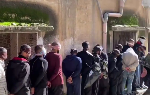 Thumbnail preview image for the video titled: Israeli soldier from the Kfir Brigade displays tens of Palestinians kidnapped and abused in the city of Tulkarem