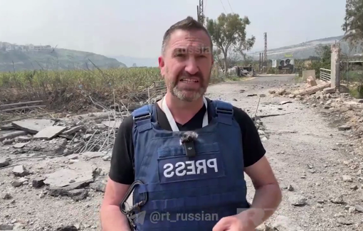 Thumbnail preview image for the video titled: The moment Irish correspondant for RT, Steve Sweeney, was injured by an Israeli airstrike