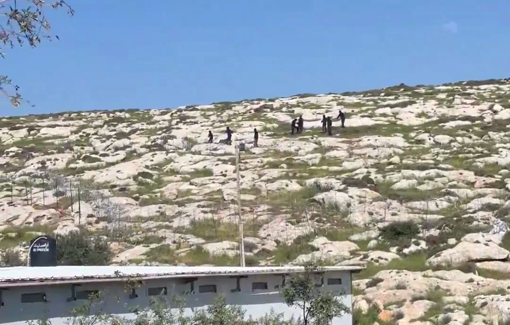 Thumbnail preview image for the video titled: About a dozen settlers descended again from Kol Mevaser outpost to the Palestinian village of Mukhmas and threw rocks upon the Palestinian
