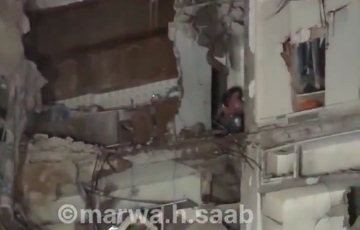 Thumbnail preview image for the video titled: A Lebanese woman in a state of shock, trapped inside a destroyed building following Israeli shelling on Beirut